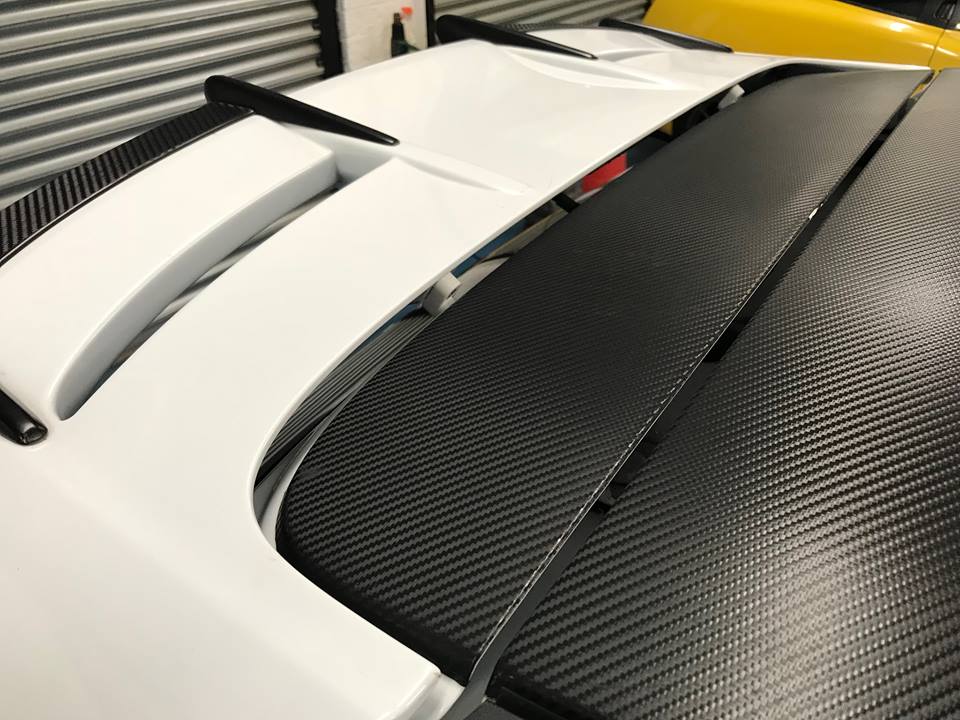 Fiesta MK7 MK7.5 spoiler risers - black metal, stainless hardware
