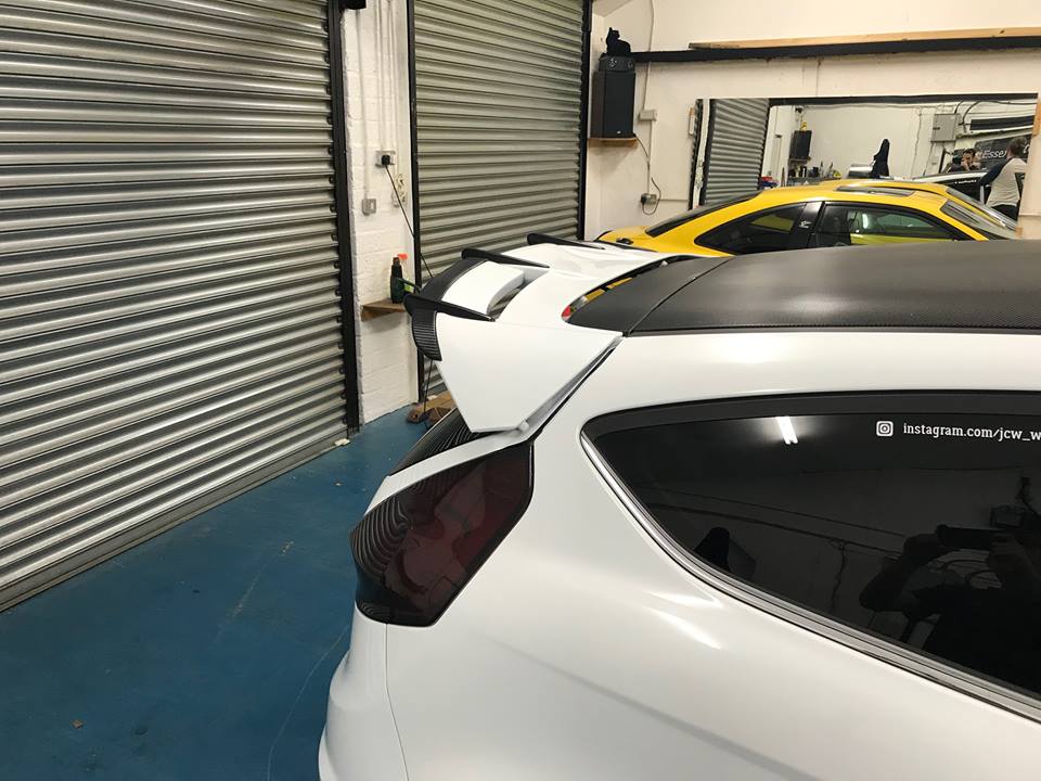 Fiesta MK7 MK7.5 spoiler risers - black metal, stainless hardware