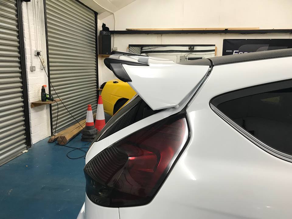 Fiesta MK7 MK7.5 spoiler risers - black metal, stainless hardware