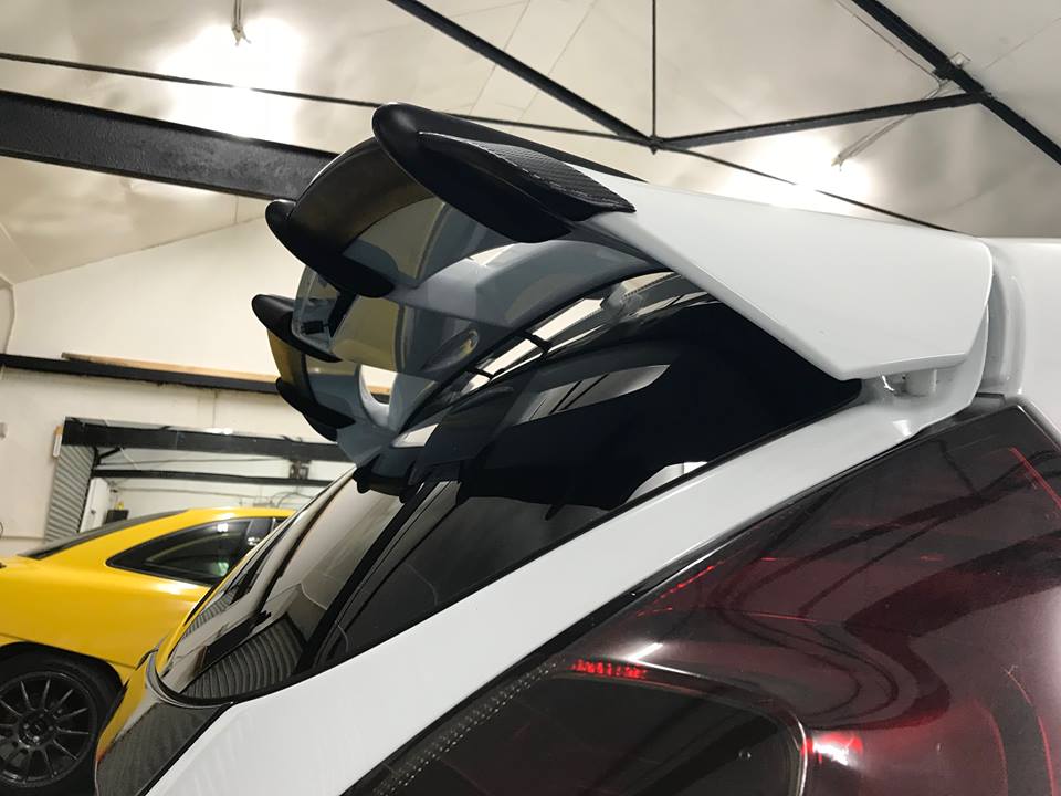 Fiesta MK7 MK7.5 spoiler risers - black metal, stainless hardware